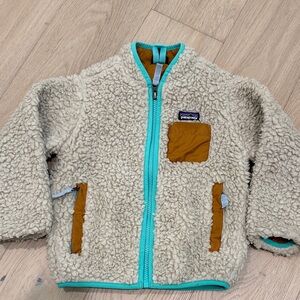 Patagonia Cream Sherpa Jacket with Turquoise and Brown Details